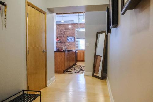 a hallway leading to a kitchen in a house at 1800 Sq Ft Loft Downtown Near Convention Center in Indianapolis