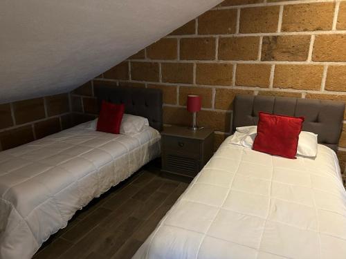 Cama o camas de una habitación en Cabañas Rancho San Jorge
