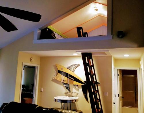 a room with a shelf and a table with a lamp at WOW Location Incredible Views in Osage Beach