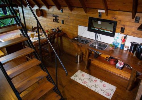 Televisyen dan/atau pusat hiburan di Cabana com Cachoeira Privativa