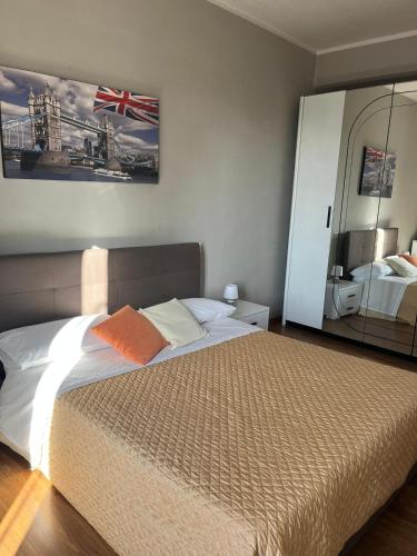 a bedroom with a bed and a large mirror at casa mioara in Montefiascone