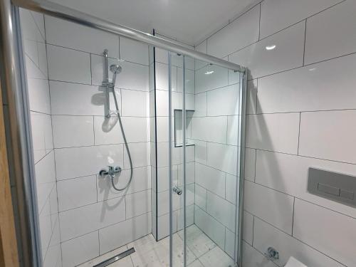 a bathroom with a shower with a glass door at Casa Vagabundo Boutique Hotel - Adults Only in Alanya