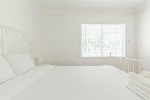 Ένα ή περισσότερα κρεβάτια σε δωμάτιο στο Ideal 4BR2BA Home for Family Vacations