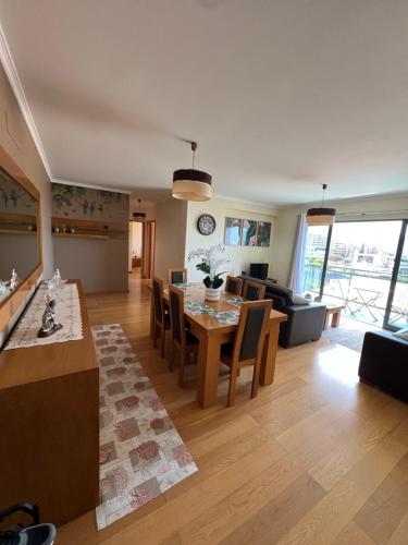 a living room with a table and a couch at Heart of Madeira in Funchal