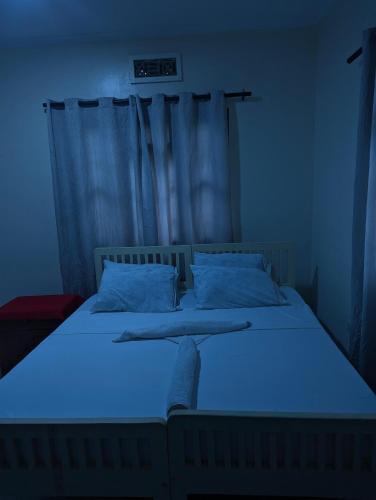 Кровать или кровати в номере JACARANDA HOMESTAY