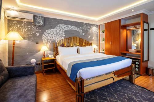 a hotel room with a bed and a couch at Gigiri Lion Villas I in Nairobi
