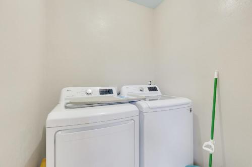 a white washer and dryer in a room at Walkable Private Guest House Studio with Pickleball Court in Austin