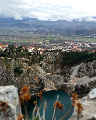 a view of a mountain with a body of water at Holiday house between the sea and lakes in Grubine