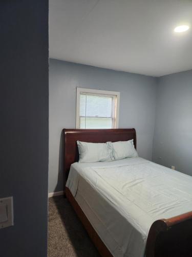 a bedroom with a bed and a window at 2BR in Peaceful Country Near Ithaca in Willseyville