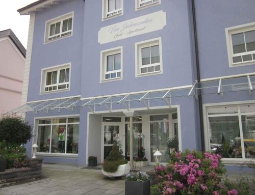 a blue building with flowers in front of it at Apartment in Bad Steben - Bayern 50803 in Bad Steben