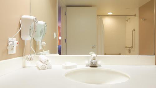 a bathroom with a sink and a mirror at Tropicana Atlantic City, A Caesars Destination in Atlantic City
