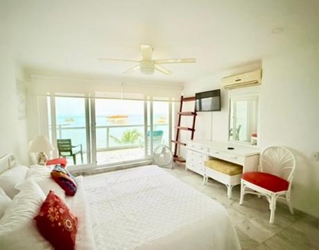 Giường trong phòng chung tại Encanto Marino Sunrise