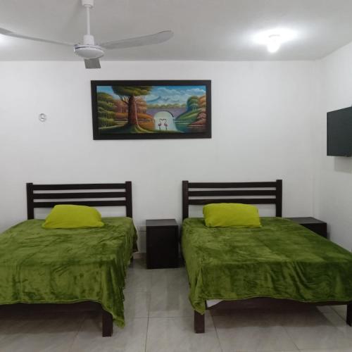 Ένα ή περισσότερα κρεβάτια σε δωμάτιο στο Habitaciones Aurelia