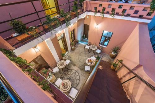 an overhead view of a courtyard with tables and chairs at Sperveri Boutique Hotel in Rhodes Town