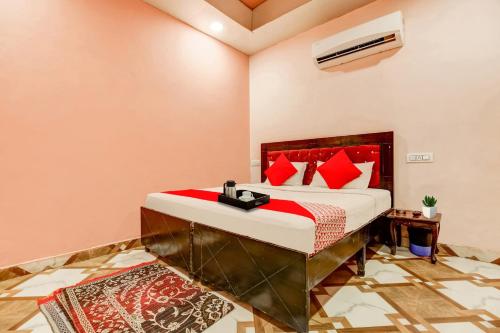 Ένα ή περισσότερα κρεβάτια σε δωμάτιο στο Hotel O Colour