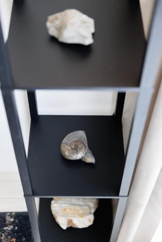 a shelf with two rocks on top of it at Hotel Hs Park Chitose in Chitose