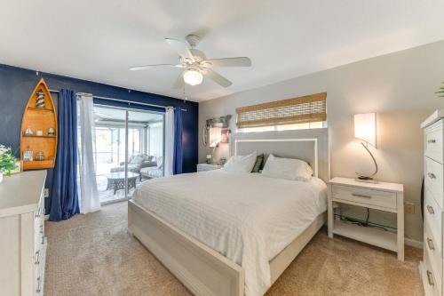 a bedroom with a bed and a ceiling fan at Fish, Swim and Relax Canal-Front Port Charlotte Gem in Port Charlotte