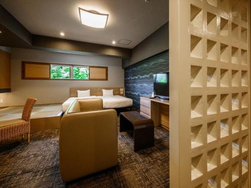 Postel nebo postele na pokoji v ubytování Lit Hotel NAKIJIN