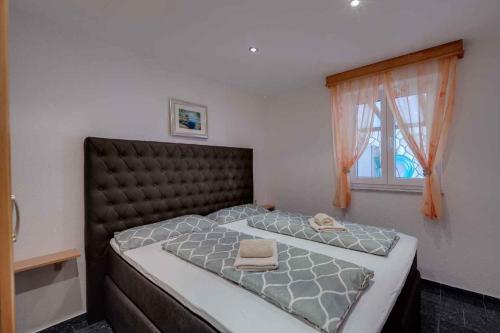 Postel nebo postele na pokoji v ubytování Crikvenica Apartment 17