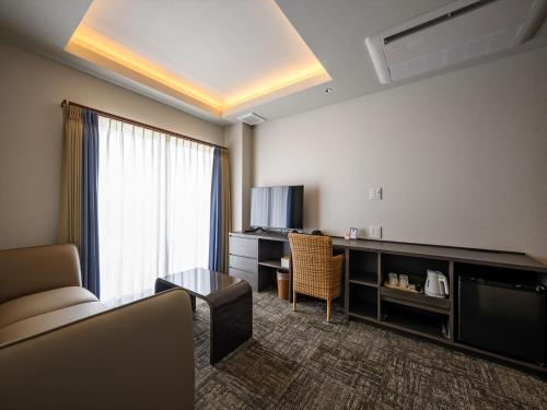 TV a/nebo společenská místnost v ubytování Lit Hotel NAKIJIN