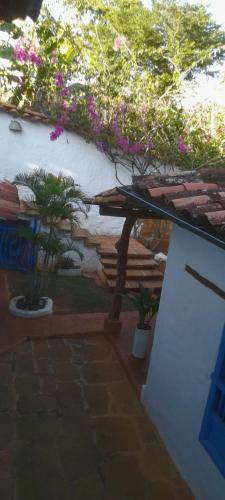a patio with two potted plants next to a building at Casa Bakero in Barichara