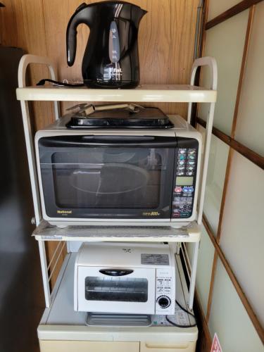 Una cocina o zona de cocina en ゲストハウス鷹乃巣
