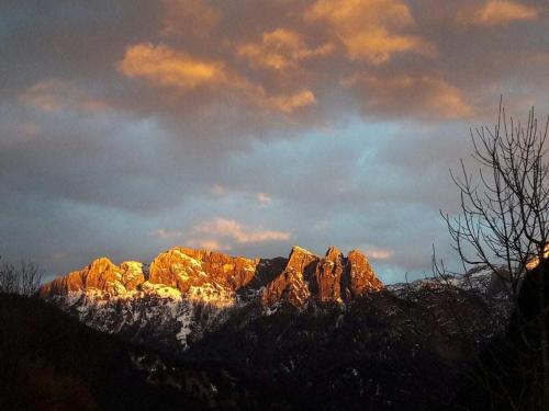 a view of a mountain with snow on it at Cowshed with private sauna in Unken