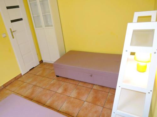 a small room with a bed and a ladder at Holiday apartment for 4 people, Lubin in Lubin