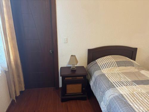 Ένα ή περισσότερα κρεβάτια σε δωμάτιο στο Deluxe Cumbaya Suite
