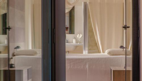 a bathroom with a bath tub and a mirror at A Casa in Ravenna