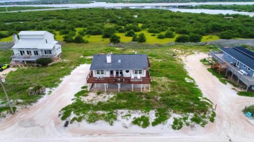 an aerial view of a house on the beach at Wake Up to Waves - 3BR on the Sand in Cedar Landing