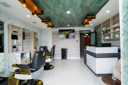 a hair salon with a barber chair in a room at Esiankiki Resort & Spa - Nanyuki in Nanyuki