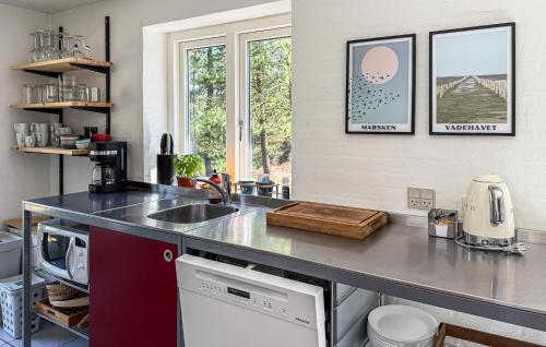 a kitchen with a sink and a counter top at Holiday Home A Hveyselsvej Rømø V in Rømø Kirkeby