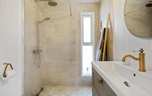 a bathroom with a shower and a sink and a mirror at Lovely Home In Kerteminde With Wifi in Kerteminde