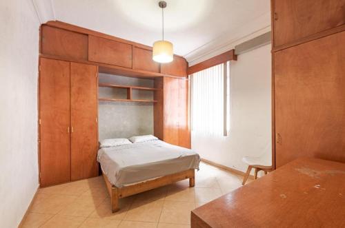 Postel nebo postele na pokoji v ubytování casa de los espejos Av Cuauhtémoc