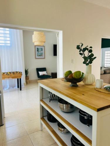 a kitchen with a counter with a bowl of fruit on it at Tropical Oasis! 5BR Luxe Home in Dorado