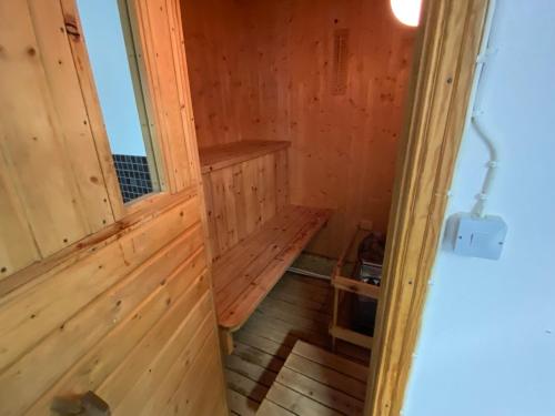an inside view of a wooden cabin with a stairway at Mysig stuga med bastu och kanot in Lidhult