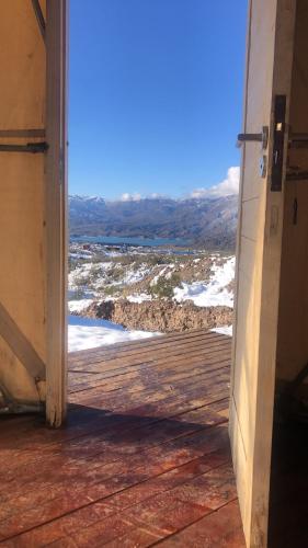 an open door to a deck with a view at Terrana Ecolodge Mountain Domes in Ciudad Lujan de Cuyo