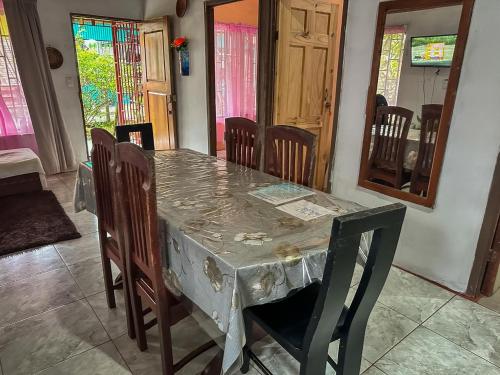 a dining room with a table and chairs at Tortuguero Family House in Colorado