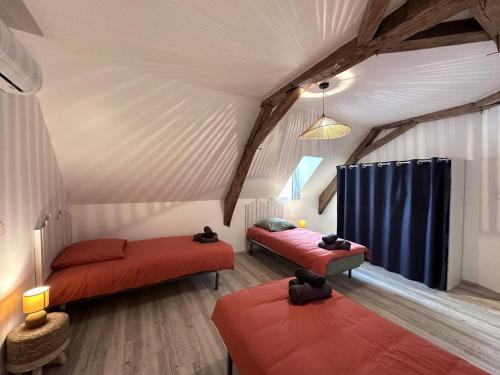 a room with two beds in a tent at Gîte Beaucotray rénové 1840 avec jeux pour enfants, campagne paisible - FR-1-489-546 in Rocles