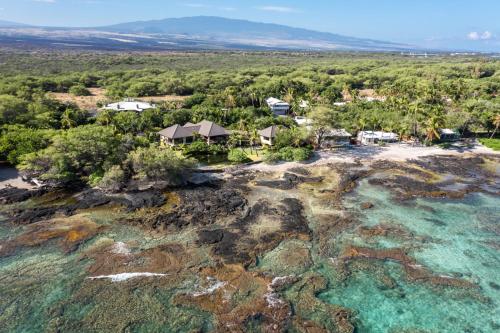 an aerial view of a house on a tropical island at Hale Waima Lani in Puako