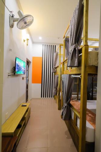 a corridor of a dorm room with bunk beds at Happy Bear Hostel Phu Quoc in Phu Quoc