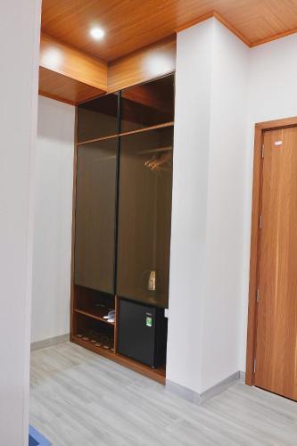an empty room with a large glass wall at Diamond Luxury Hotel & Café Măng Đen in Kon Plong
