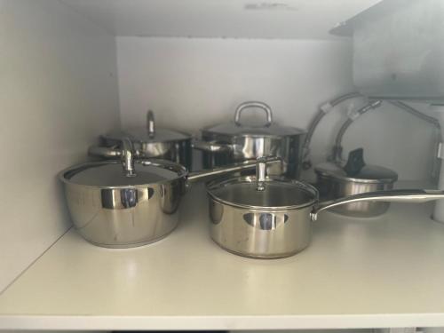 a group of pots and pans on a kitchen counter at Liz Garden country house in Woori Yallock