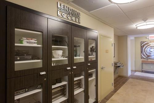 a row of lockers in a hallway at Candlewood Suites San Marcos by IHG in San Marcos
