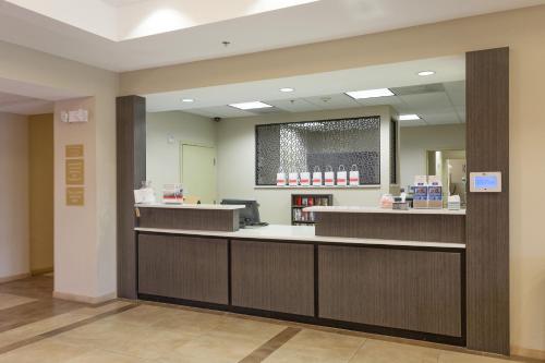 a waiting room with a counter in a pharmacy at Candlewood Suites San Marcos by IHG in San Marcos
