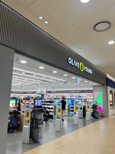 a store with a woman walking in a shopping mall at Gate303 in Seoul