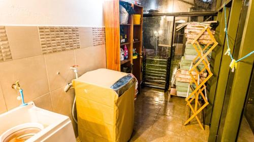 a small bathroom with a toilet and a shelf at Casa en Calca in Calca