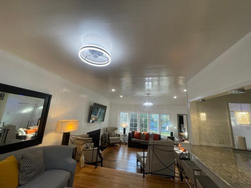 a living room with a couch and a table at Entire 5 Bedrooms Home near DC and Metro in Silver Spring