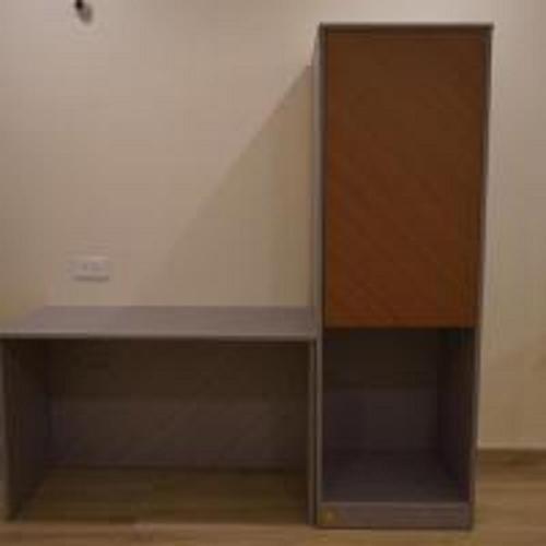 a cabinet in a room with a staircase at Aroma Prayagraj By StayApart in Prayagraj